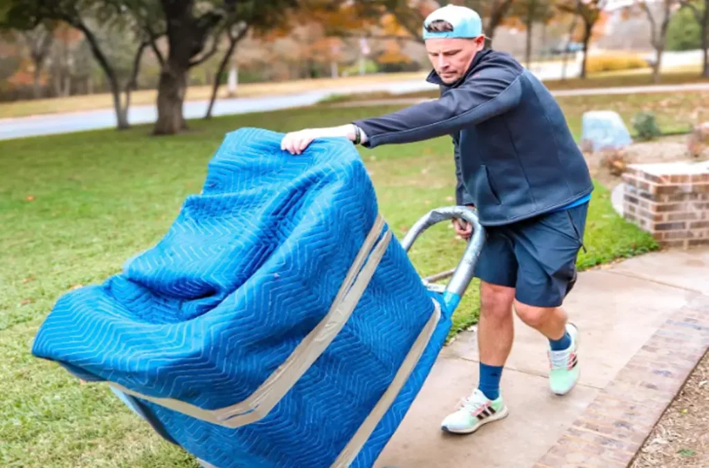 a member of Brazos Movers preparing for a long distance move