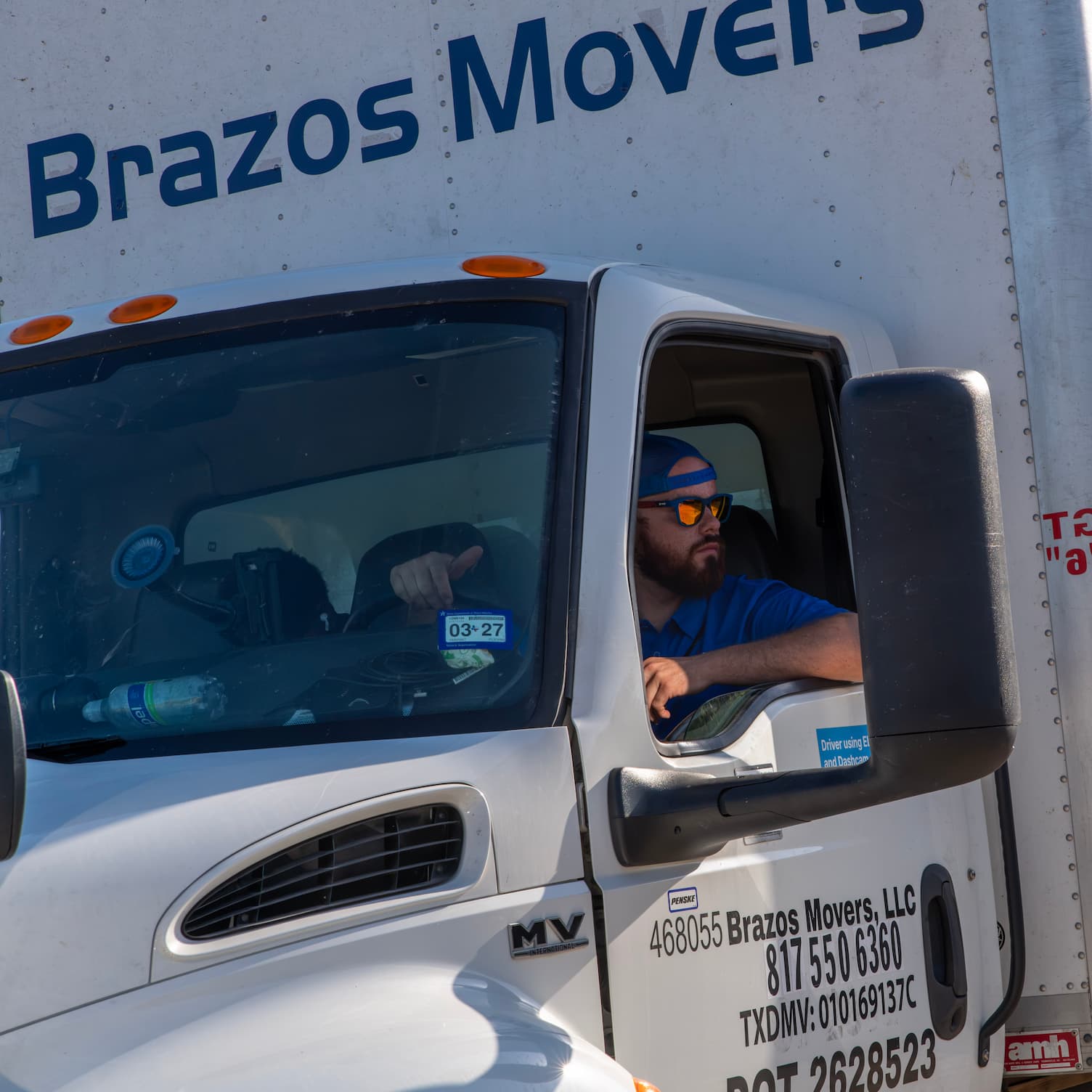Employee Driving Brazos Movers Truck