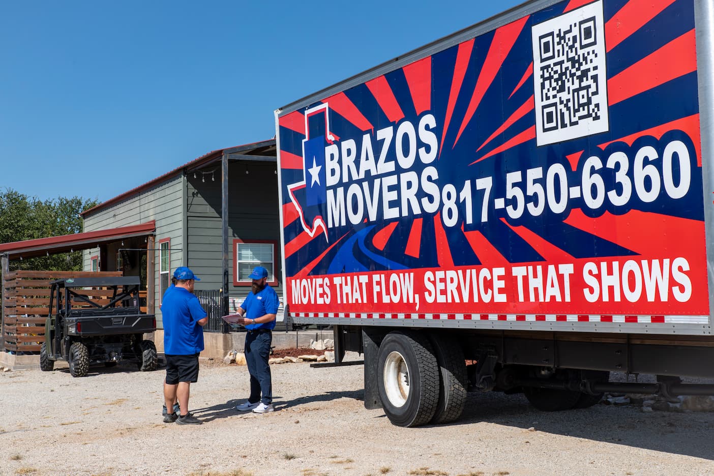 Team Organizing a Moving in Front Brazos Movers Truck